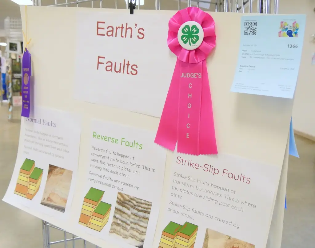 a poster about Earth's faults on display at a fair