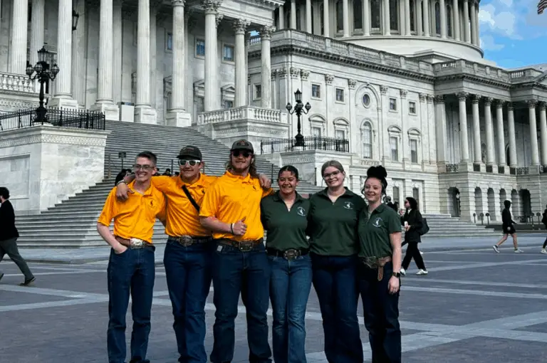 a group of young people pose for a photo outside the US capital