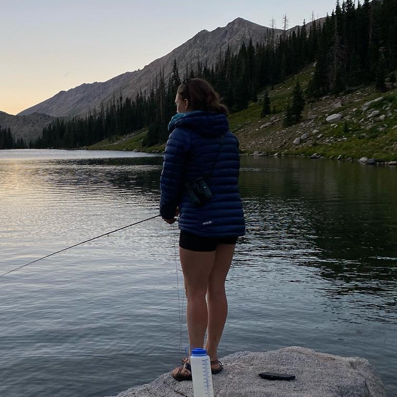 Fishing at a mountain lake during sunset