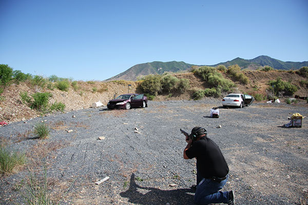 Person shooting at a car