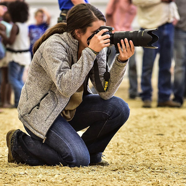 Kyndal taking pictures in the ring