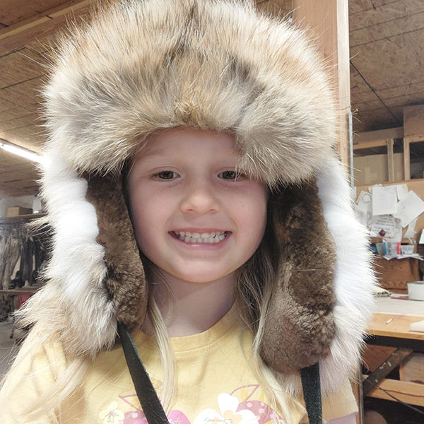 Child wearing fur hat